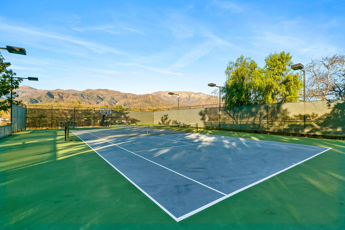 tennis court with mountain views