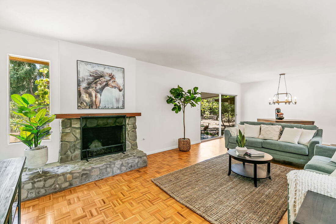 Stone fireplace in living room in Ojai home for sale