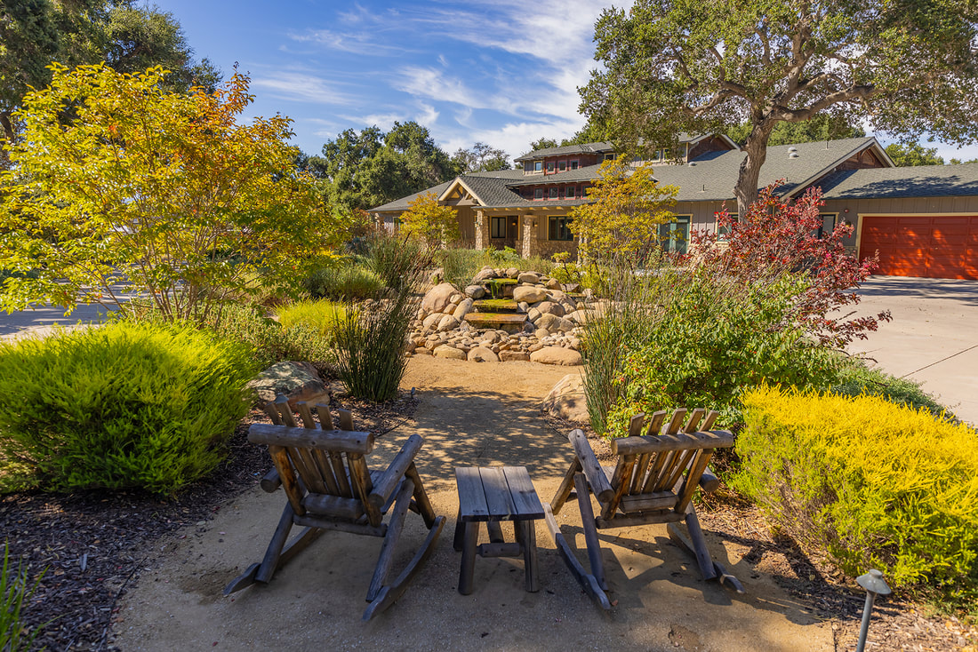 chairs and rock fountain at ojai home for sale