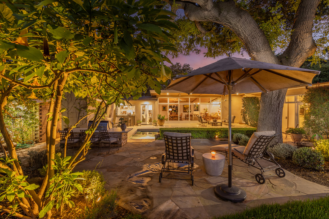 outdoor living area with pool and grill at twilight in ojai